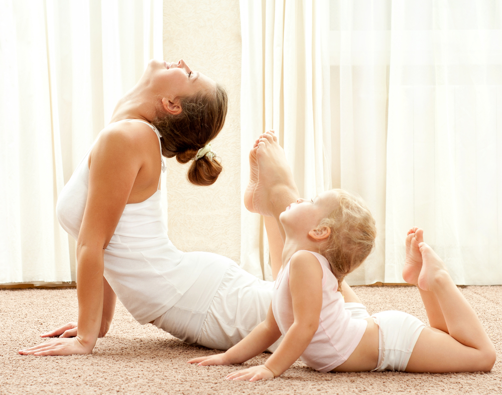 mother-and-daughter-exercising-at-home